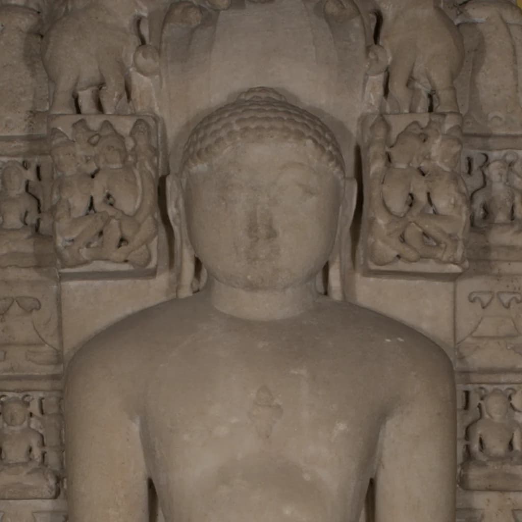 A close-up view of the Parshvanath Sculpture, showing the serene face and stone composite texture of the Tirthankara figure.
