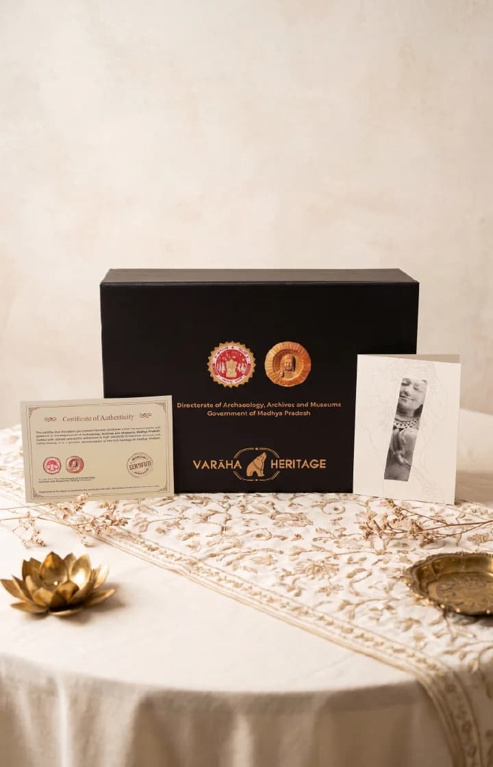 A black presentation box for the Salabhanjika Sculpture museum replica, displayed with its official certificate of authenticity and informational card.