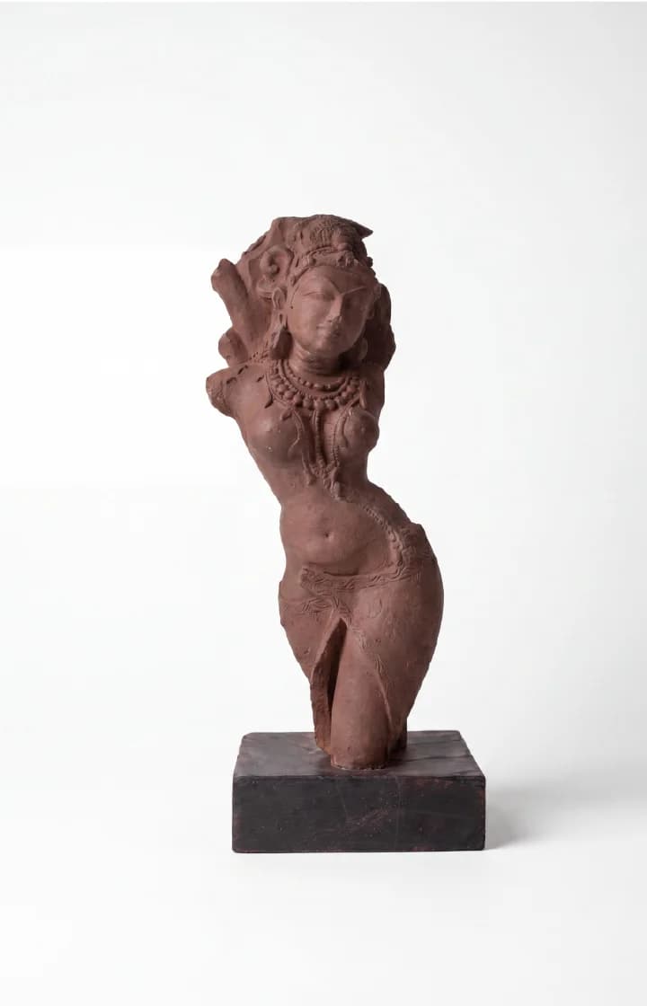 A three-quarter view of the Salabhanjika Sculpture, a stone composite museum replica showing an elegant figure in tribhanga pose.