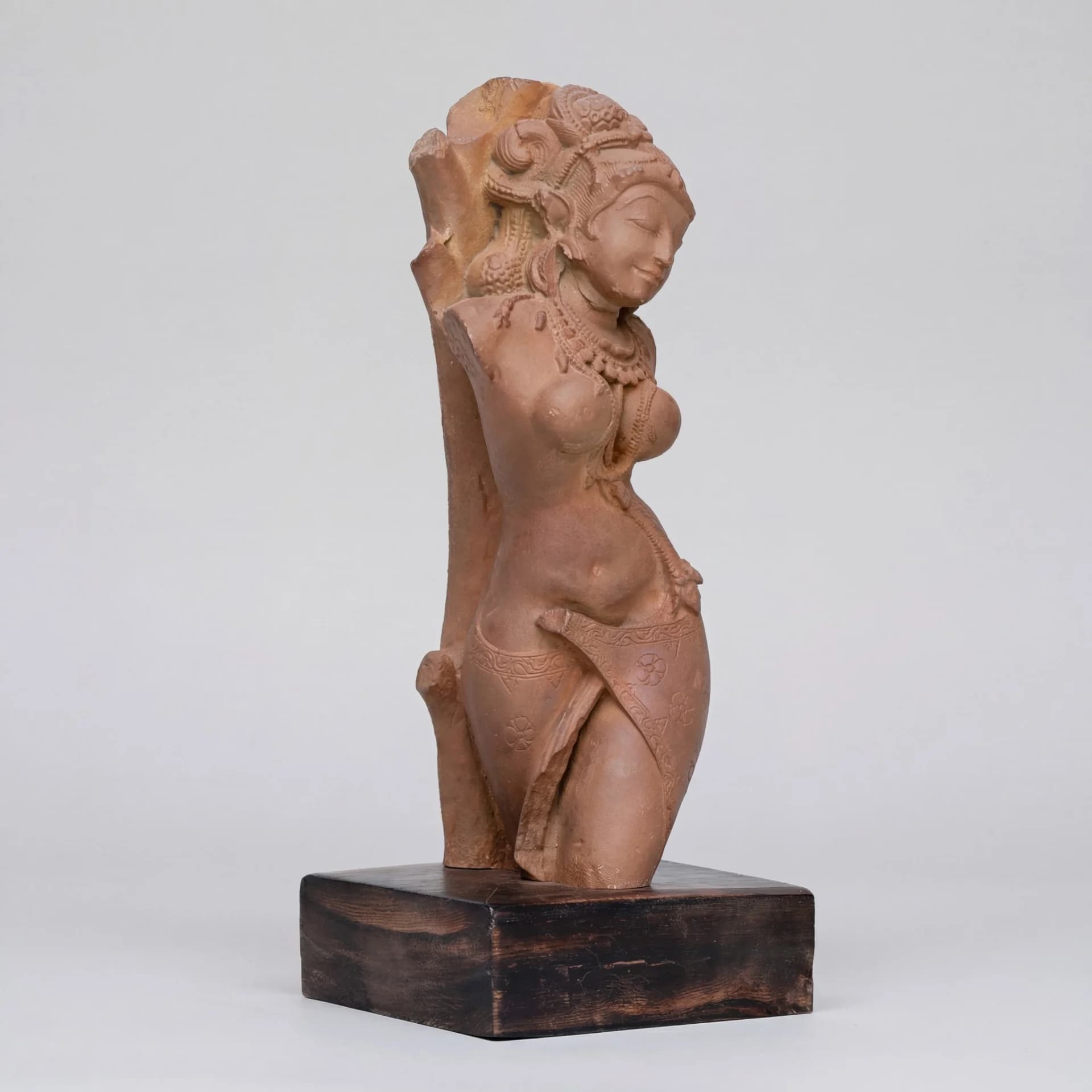 A three-quarter view of the stone composite Salabhanjika Sculpture showing her elegant tribhanga pose and intricate carved details.