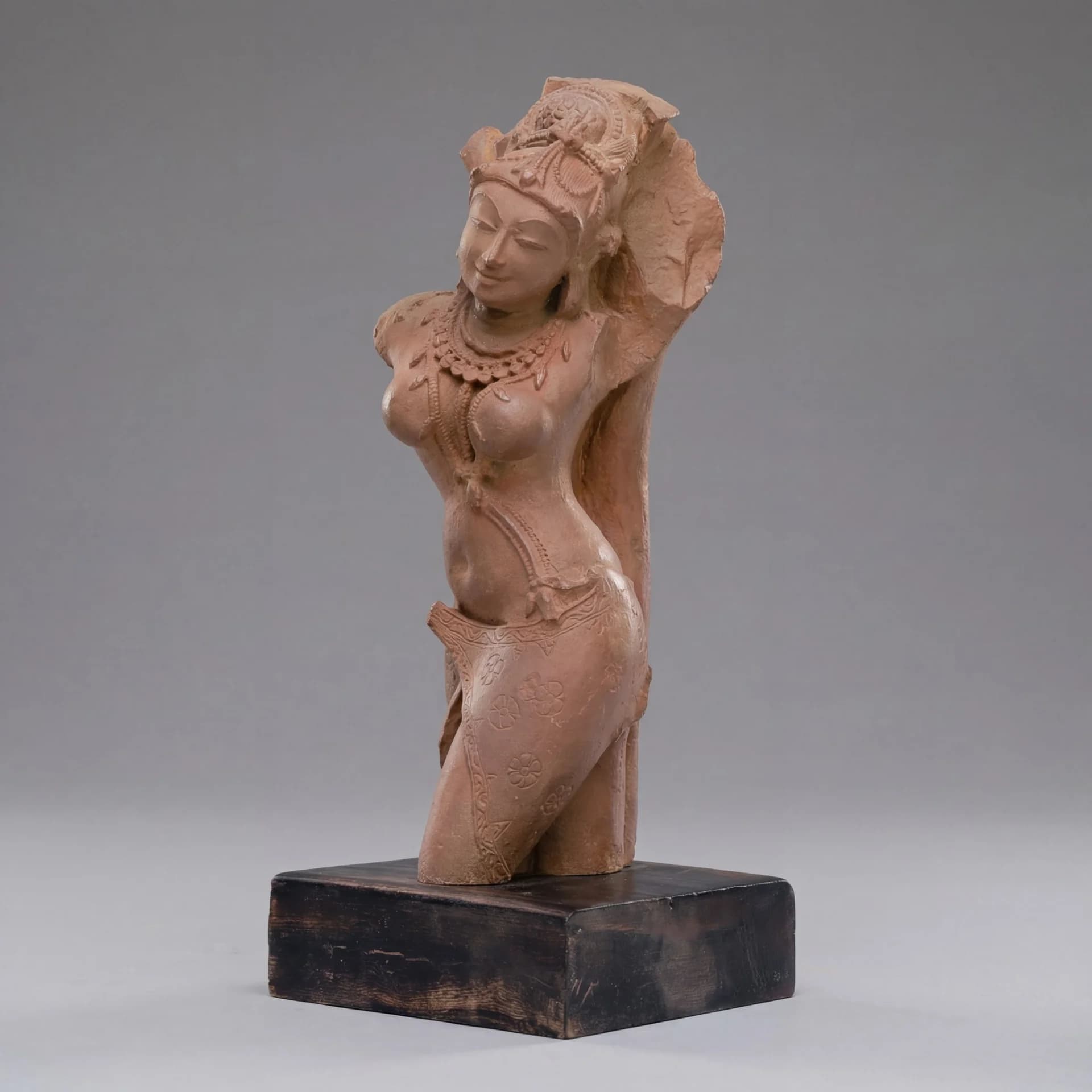 A three-quarter view of the Salabhanjika Sculpture, a stone composite replica showing the figure in a graceful tribhanga pose.