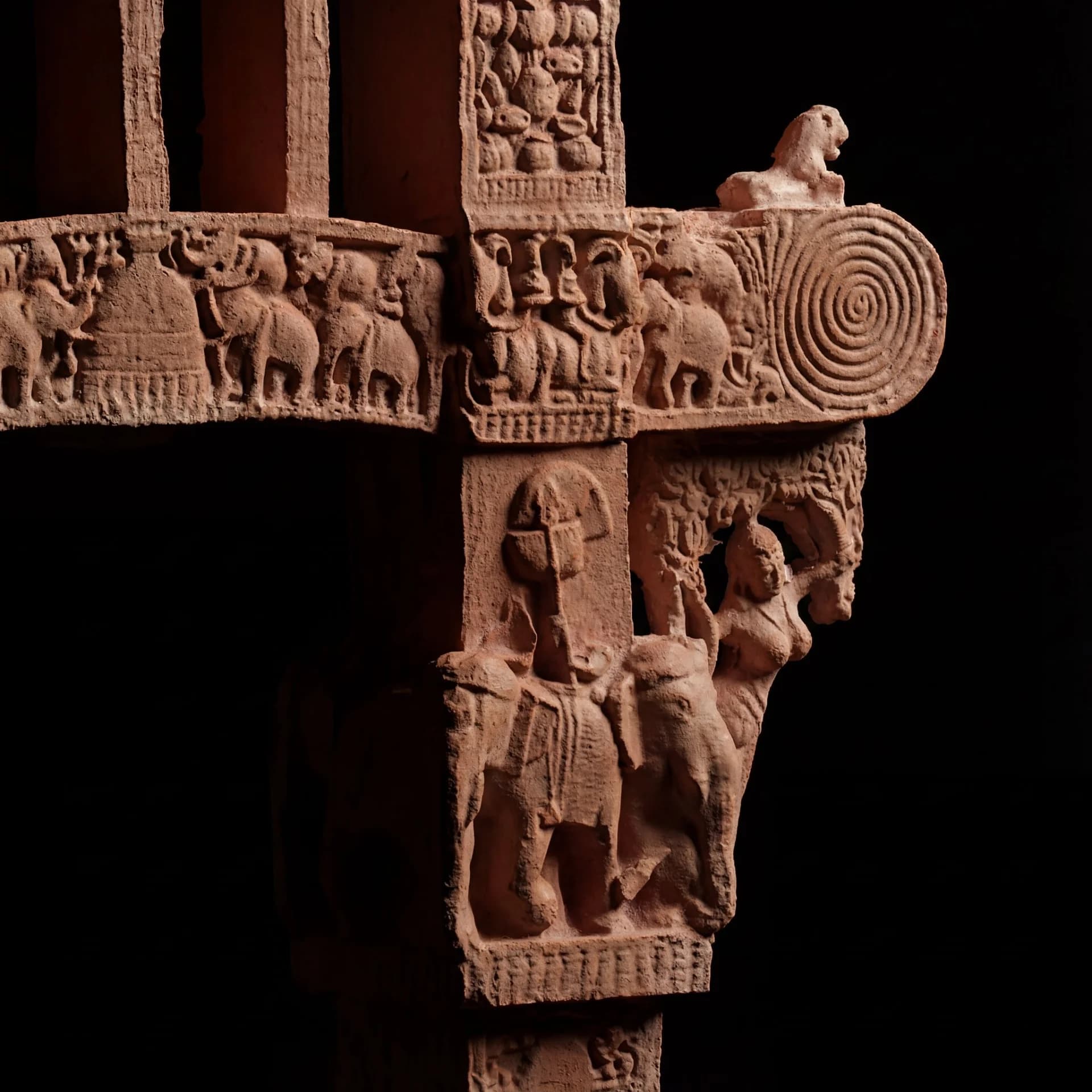 A detailed closeup of the Sanchi Torana Gateway Miniature showing stone composite carvings of elephants and ancient Buddhist motifs.