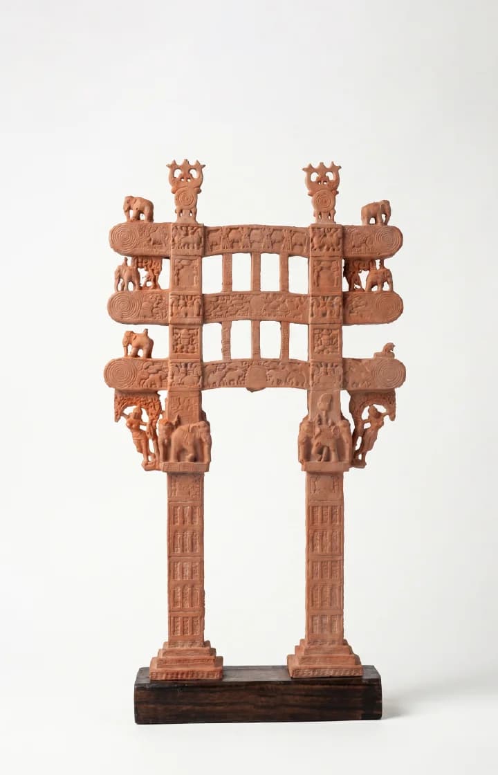 A full front view of the Sanchi Torana Gateway Miniature, featuring intricate terracotta-style carvings of elephants and ancient Buddhist motifs.