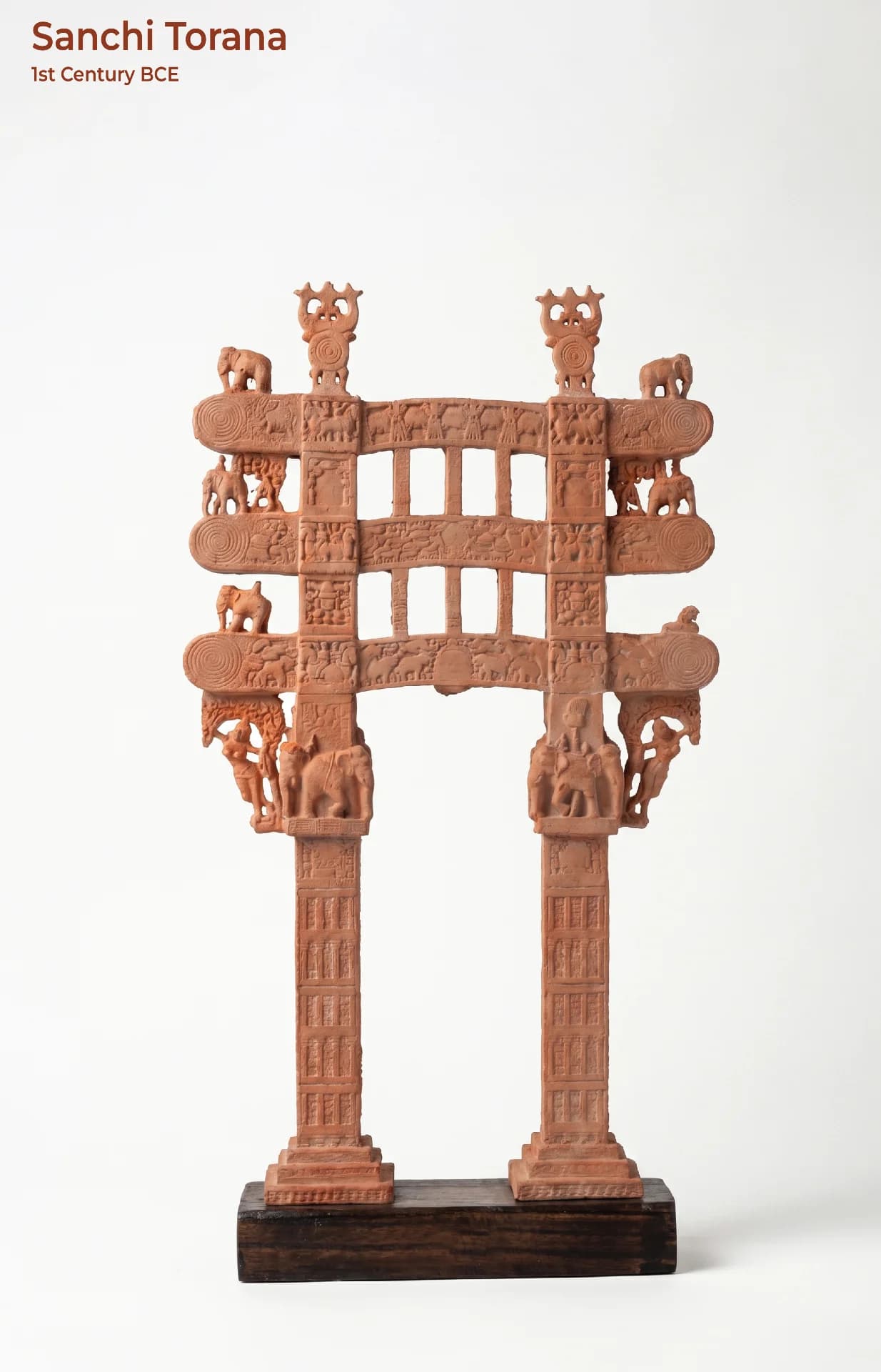 A full-front view of the Sanchi Torana Gateway Miniature, featuring intricate terracotta-style carvings of elephants and ancient Buddhist motifs.