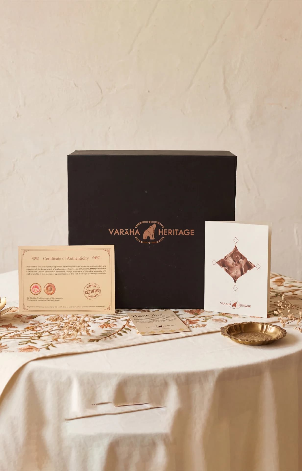 The Tripurantaka Shiva stone composite replica packaging, featuring a black gift box, certificate of authenticity, and informational card.