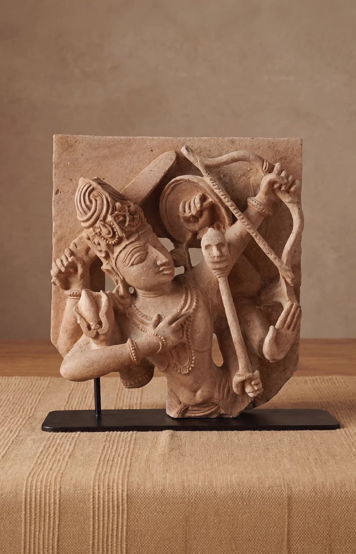 A front view of the Tripurantaka Shiva Sculpture, a stone composite replica showing the deity as a cosmic archer.